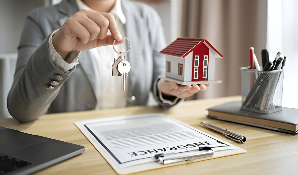 "Real estate agent handing over house keys to new homeowner during property handover process."